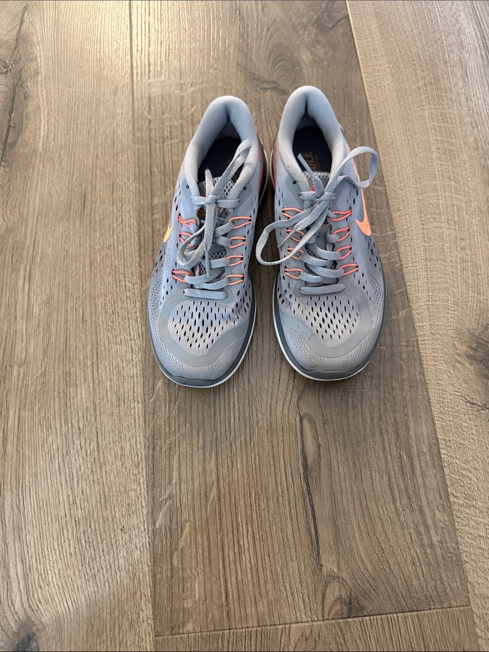 Nike Women's Light Blue Running Shoes with Coral Accents